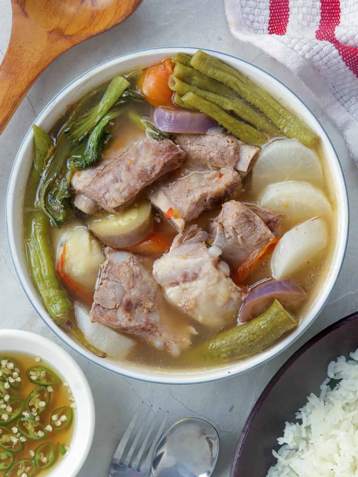 Picture of a completely finished sinigang dish in a bowl from the top view.